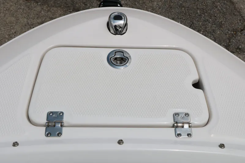 Slide: The Image of Chaparral 21 SSi 2026 boat hatch with locking mechanism. - 46
