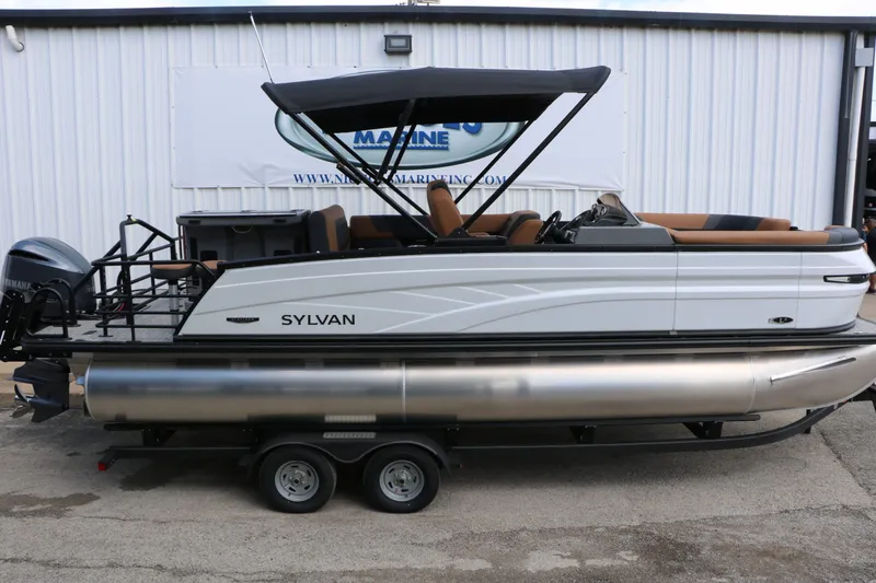 Slide: The Image of 2026 Sylvan L3 DLZ Bar Platinum Edition Tri Toon boat side view. - 19