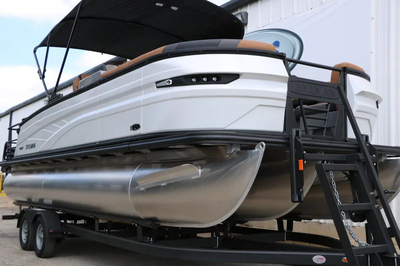 Slide: The Image of 2026 Sylvan L3 DLZ Bar Platinum Edition Tri Toon on trailer. - 7