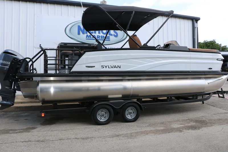 Slide: The Image of 2026 Sylvan L3 DLZ Bar Platinum Edition Tri Toon on trailer. - 8
