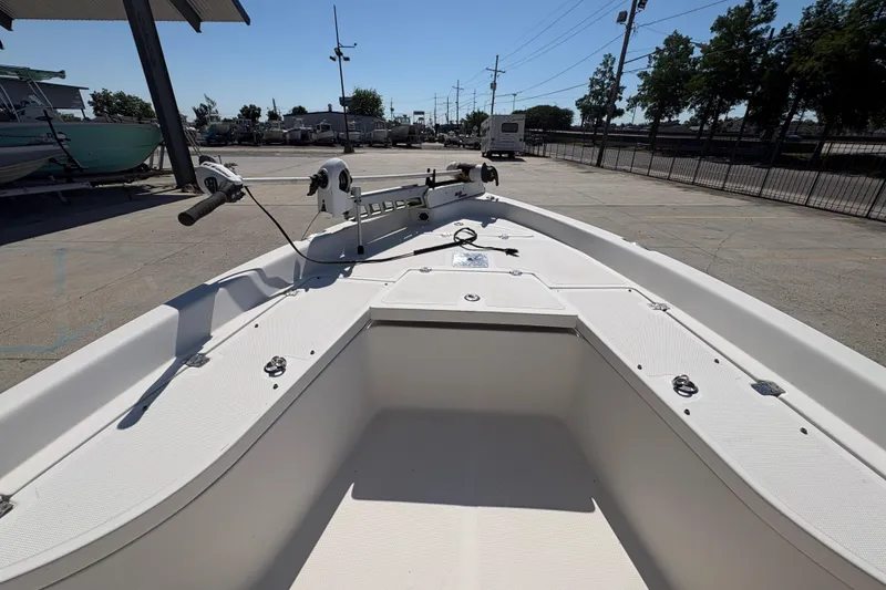 Slide: The Image of 2008 NAUTIC STAR 2110 boat interior, featuring spacious deck and fishing equipment. - 14