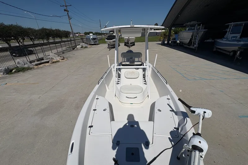 Slide: The Image of 2008 NAUTIC STAR 2110 boat docked, featuring spacious deck and modern design. - 15