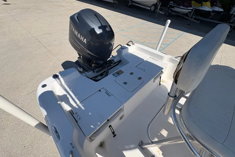 Slide: The Image of 2008 NAUTIC STAR 2110 boat with Yamaha outboard motor, featuring a spacious deck layout. - 9
