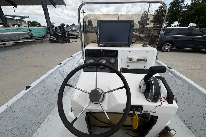 Slide: The Image of Steering console of a 2004 Kenner 18-V boat with navigation equipment. - 20