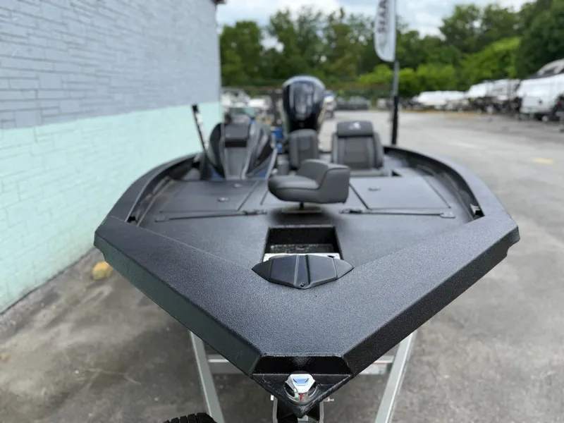 Slide: The Image of 2026 Xpress X19 Pro boat parked outdoors. - 3