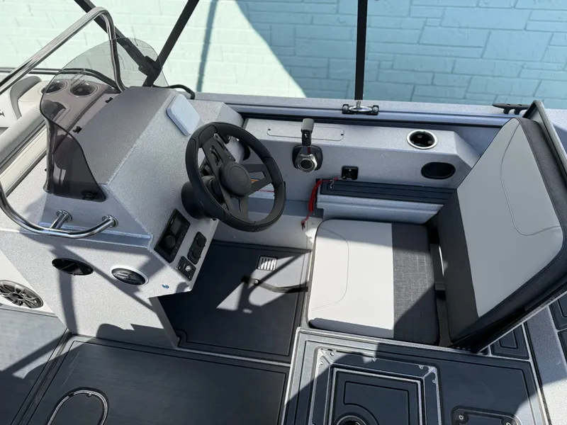 Slide: The Image of Interior of SeaArk Easy 200 boat, 2026 model, featuring steering console. - 11