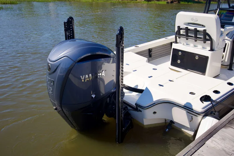Slide: The Image of 2024 Pathfinder 2500 Hybrid boat with Yamaha outboard engine on calm water. - 14