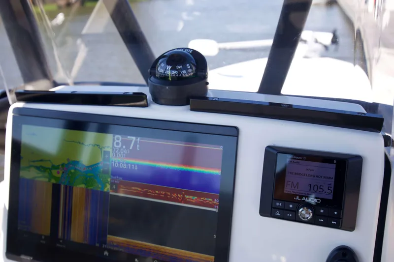 Slide: The Image of Dashboard of 2024 Pathfinder 2500 Hybrid boat with navigation and audio systems. - 22