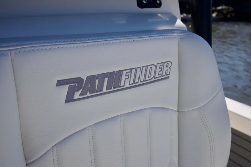 Slide: The Image of White leather seat with "Pathfinder" logo, 2024 Pathfinder 2500 Hybrid boat. - 24