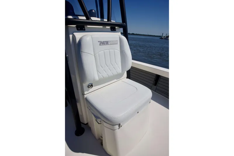 Slide: The Image of 2024 Pathfinder 2500 Hybrid boat seat with logo, on a sunny day by the water. - 25