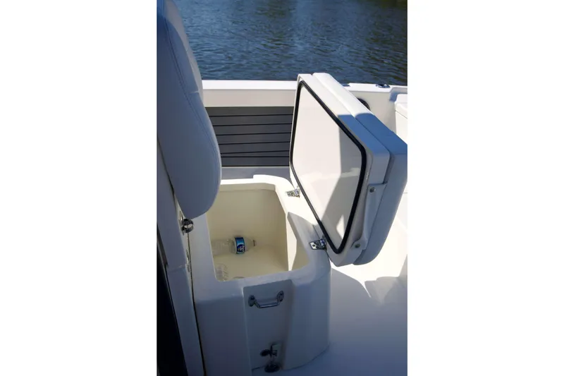 Slide: The Image of Open storage compartment on 2024 Pathfinder 2500 Hybrid boat, featuring a water bottle inside. - 27