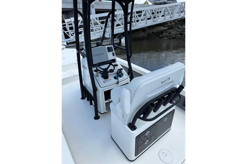 Slide: The Image of 2024 Pathfinder 2500 Hybrid boat interior with steering console and seating. - 33