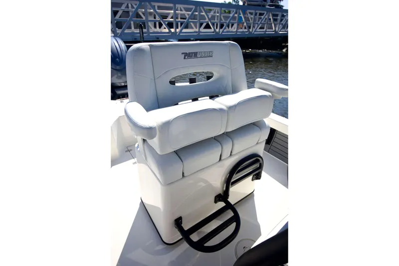Slide: The Image of 2024 Pathfinder 2500 Hybrid boat seat with cushioned armrests and step ladder. - 35