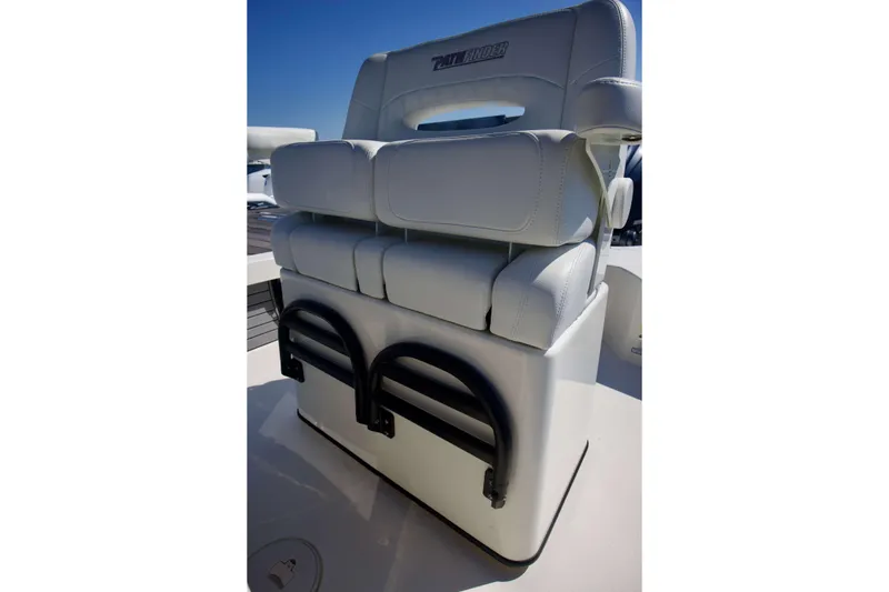 Slide: The Image of 2024 Pathfinder 2500 Hybrid boat seat with white upholstery and integrated storage. - 37
