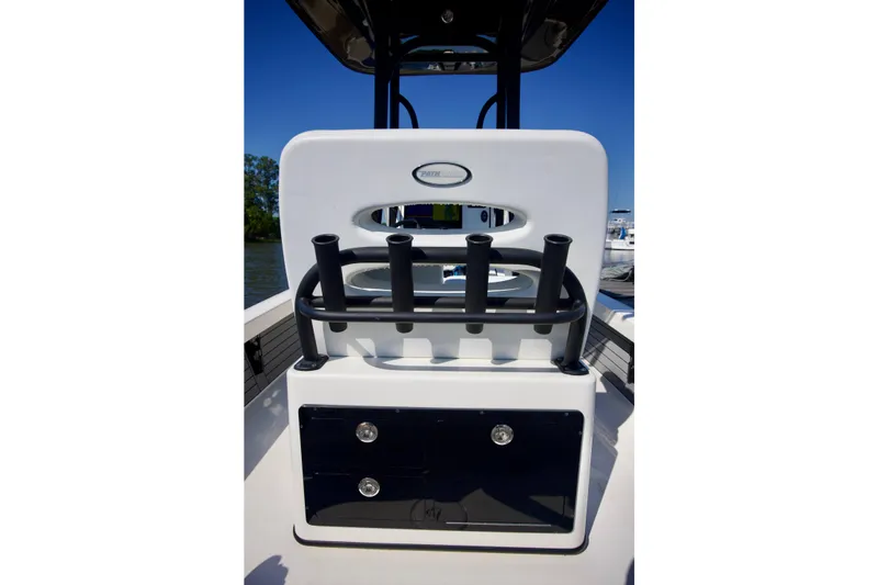 Slide: The Image of 2024 Pathfinder 2500 Hybrid boat console with rod holders and storage compartments. - 38