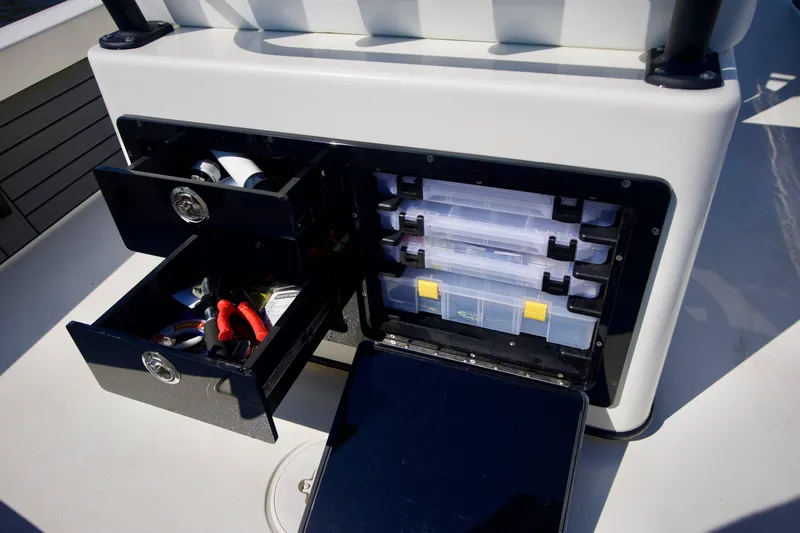 Slide: The Image of Storage compartments on 2024 Pathfinder 2500 Hybrid boat, featuring organized drawers and tackle boxes. - 40