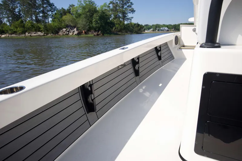 Slide: The Image of 2024 Pathfinder 2500 Hybrid boat interior with sleek design on a calm river. - 51