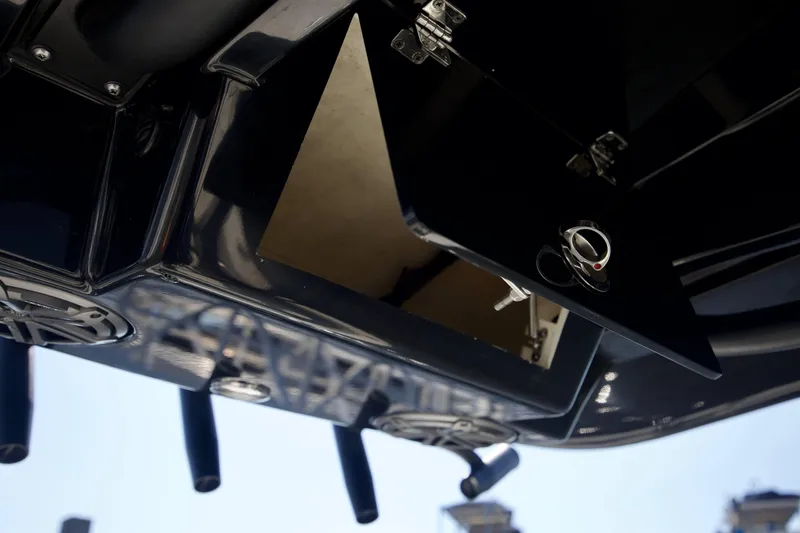 Slide: The Image of Open storage compartment on 2024 Pathfinder 2500 Hybrid boat, showcasing sleek design and functionality. - 55