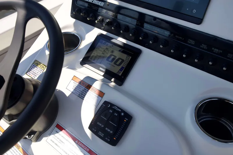 Slide: The Image of 2024 Pathfinder 2500 Hybrid boat dashboard with Yamaha display and control panel. - 57