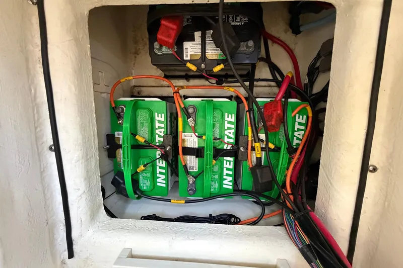 Slide: The Image of 2024 Pathfinder 2500 Hybrid battery compartment with Interstate batteries and wiring. - 66