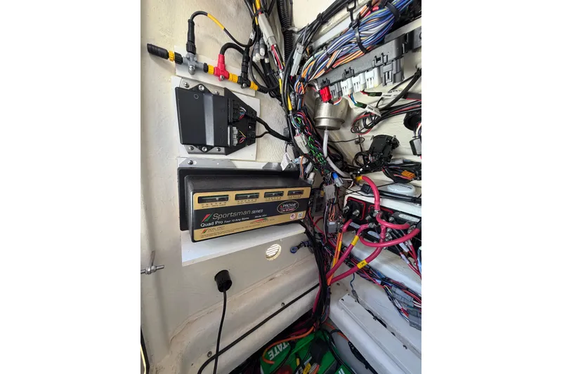 Slide: The Image of Electrical wiring and components inside a 2024 Pathfinder 2500 Hybrid boat. - 67