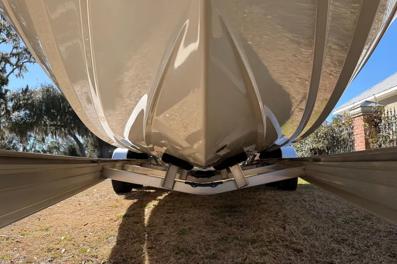 Slide: The Image of 2024 Pathfinder 2500 Hybrid boat hull on trailer, viewed from below. - 70
