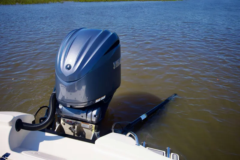 Slide: The Image of 2024 Pathfinder 2500 Hybrid boat with Yamaha outboard motor in water. - 73