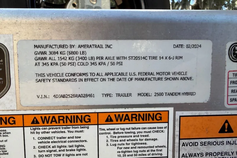 Slide: The Image of 2024 Pathfinder 2500 Hybrid trailer label with specifications and safety warnings. - 78