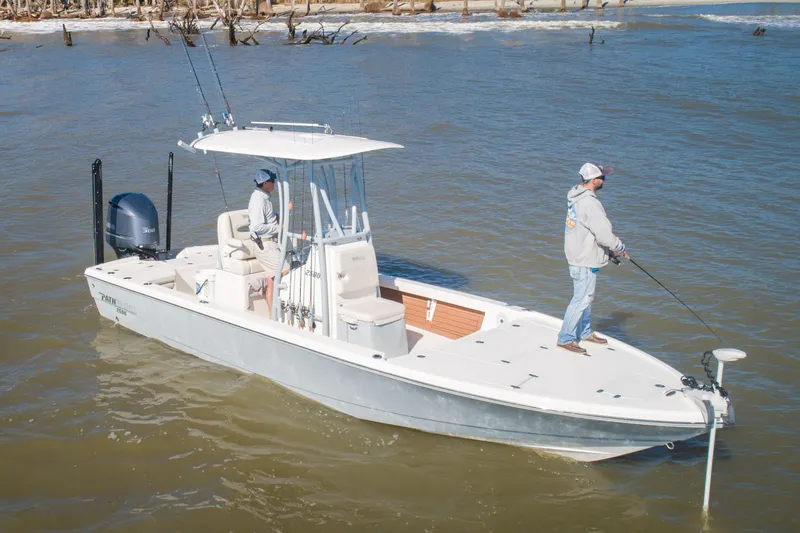 Slide: The Image of Manufacturer Provided Image: 2024 Pathfinder 2500 Hybrid boat with two people fishing on a calm river. - 79