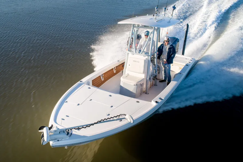 Slide: The Image of Manufacturer Provided Image: 2024 Pathfinder 2500 Hybrid boat cruising on water. - 82
