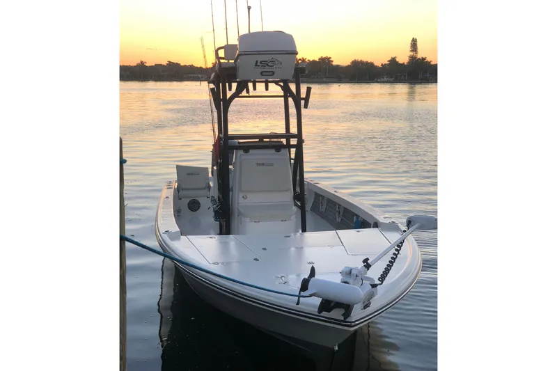 Slide: The Image of Manufacturer Provided Image: 2024 Pathfinder 2500 Hybrid boat docked at sunset. - 85