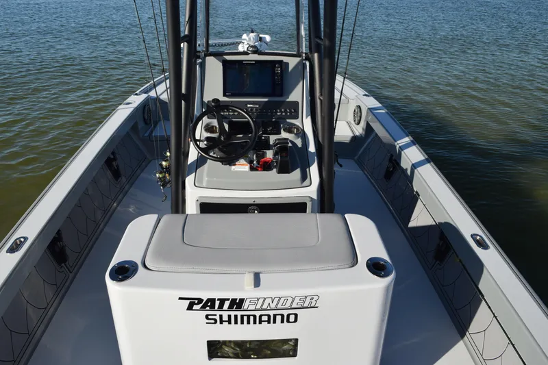 Slide: The Image of Manufacturer Provided Image: 2024 Pathfinder 2500 Hybrid boat interior with steering console and navigation equipment. - 86