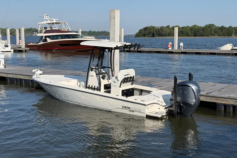 Slide: The Image of 2024 Pathfinder 2500 Hybrid boat docked at marina with Yamaha outboard engine. - 9