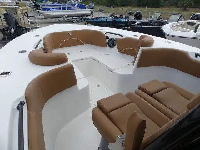 Slide: The Image of Interior of a 2026 Key West 291 FS boat with brown seating. - 12