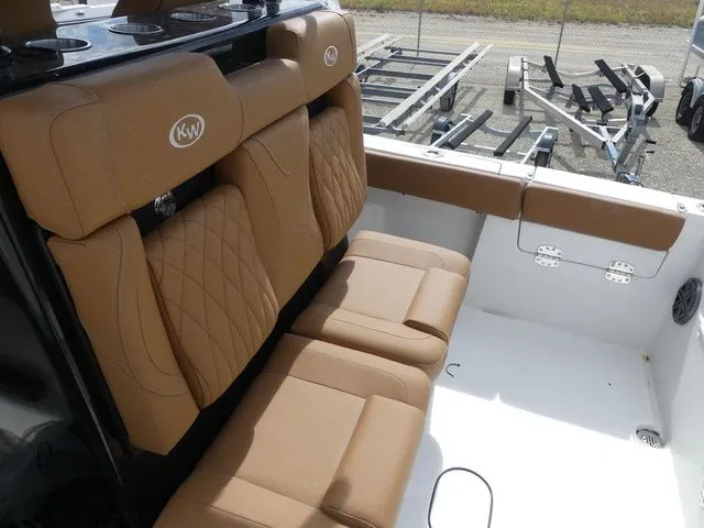 Slide: The Image of Interior of Key West 291 FS boat, 2026 model, featuring brown leather seats. - 19