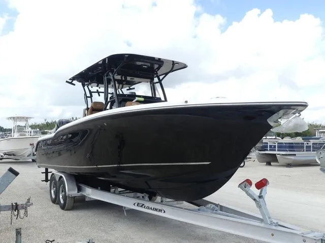 Slide: The Image of 2026 Key West 291 FS boat on trailer, black design. - 3