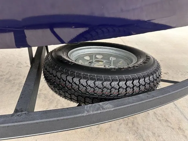Slide: The Image of Spare tire on Tracker Pro Team 175 TXW boat trailer, 2022 model. - 10