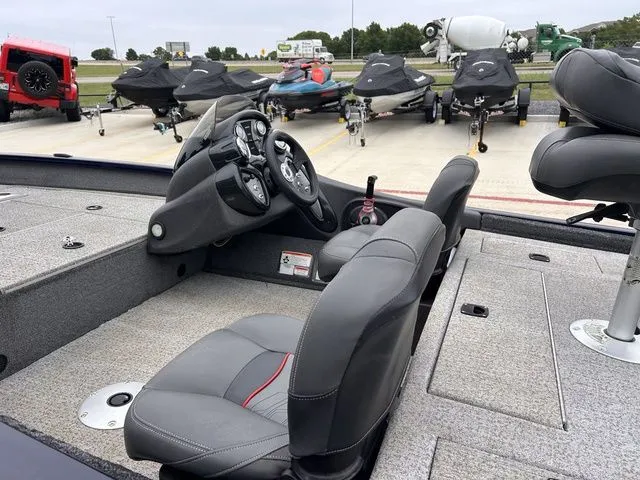 Slide: The Image of Interior of a 2022 Tracker Pro Team 175 TXW boat in a parking lot. - 6