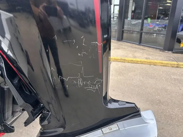 Slide: The Image of Scratches on Tracker Pro Team 190 TX boat motor, 2022 model. - 6