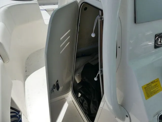 Slide: The Image of Open storage compartment on a 2024 Key West 263 FS boat. - 18
