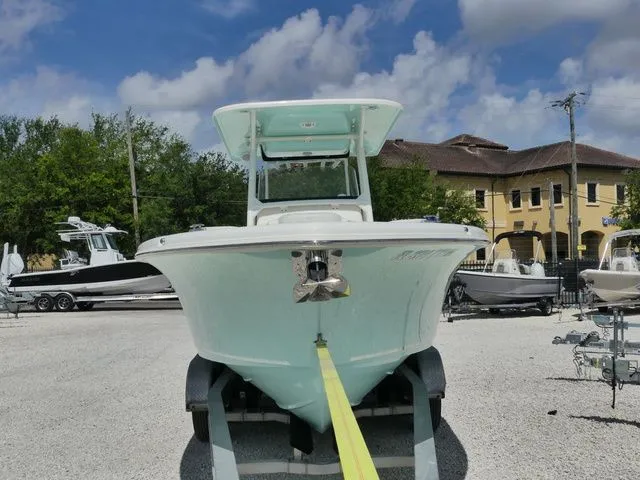 Slide: The Image of 2024 Key West 263 FS boat on trailer outdoors. - 3