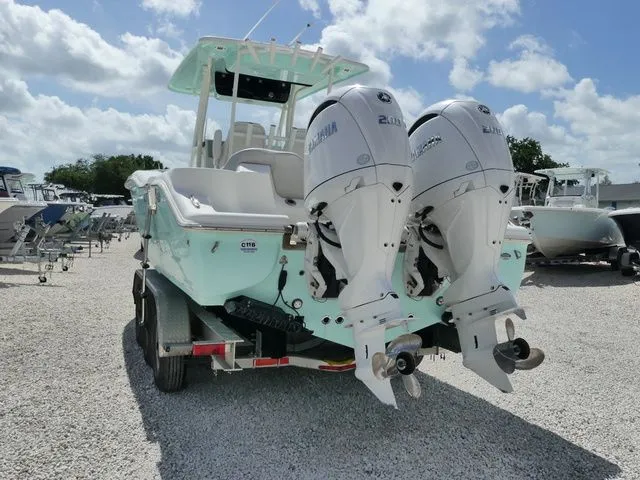 Slide: The Image of 2024 Key West 263 FS boat with dual outboard engines. - 5