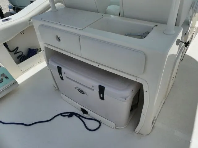Slide: The Image of 2024 Key West 263 FS boat interior with storage and cooler. - 9