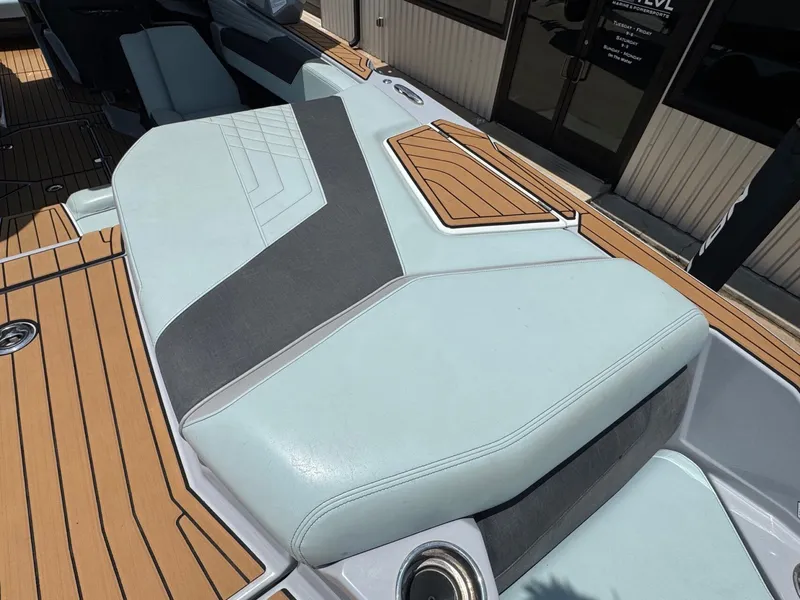 Slide: The Image of 2023 Nautique G23 boat with stylish deck design. - 11