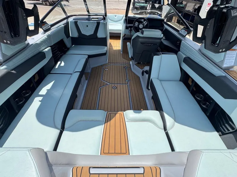 Slide: The Image of Interior of 2023 Nautique G23 boat with luxurious seating. - 13