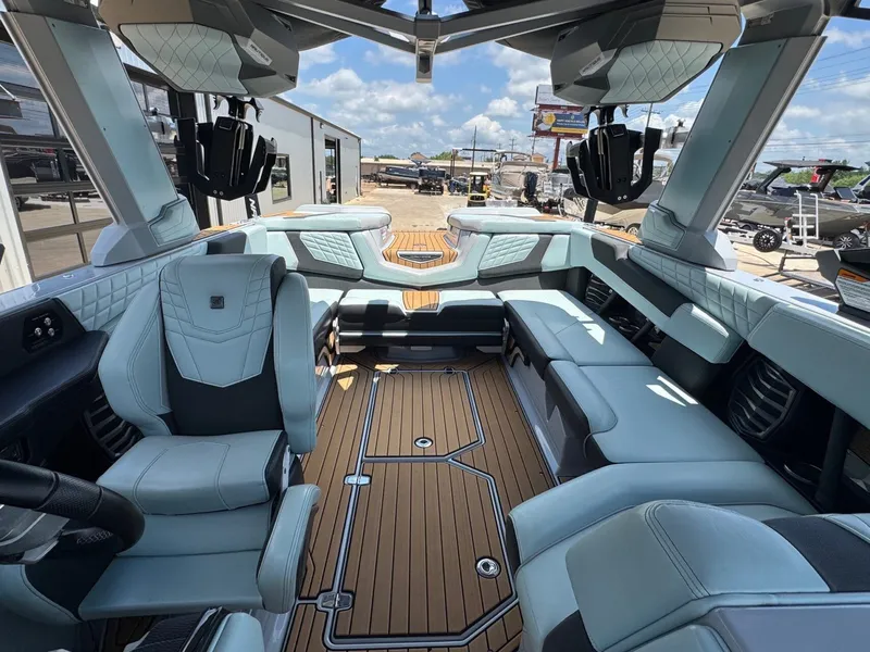 Slide: The Image of Interior of a 2023 Nautique G23 boat with luxurious seating. - 24