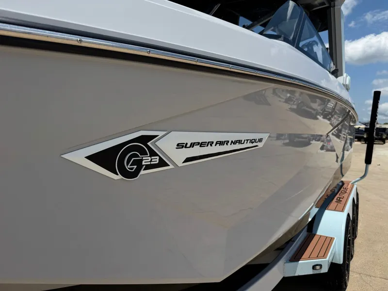 Slide: The Image of 2023 Nautique G23 boat with Super Air Nautique logo. - 3