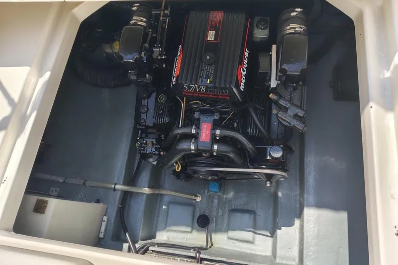 Slide: The Image of Engine compartment of a 1995 Sea Ray 250 Sundancer with a 5.7L MerCruiser engine. - 7