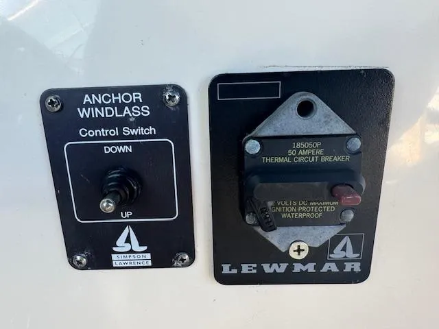 Slide: The Image of Anchor windlass control switch and circuit breaker on 2003 Rinker 282 Captiva Cuddy boat. - 16