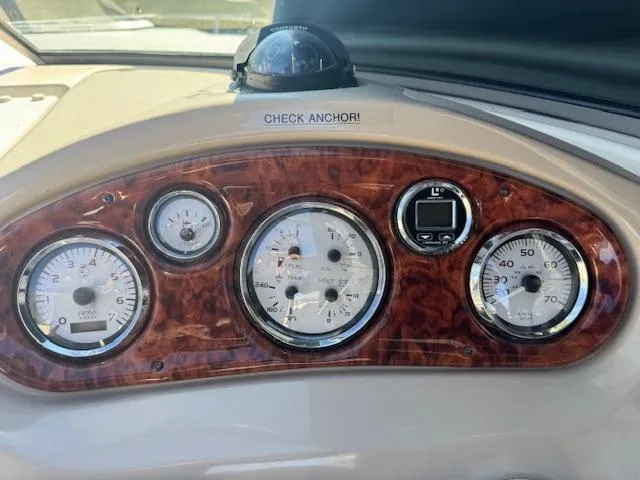 Slide: The Image of Dashboard of 2003 Rinker 282 Captiva Cuddy with gauges and "Check Anchor!" label. - 17